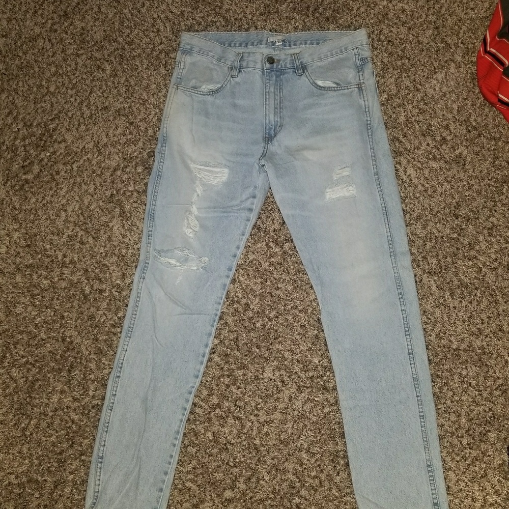 Enslaved Light Washed Ripped Jeans